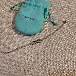 Tiffany & Co. Silver Infinity Bracelet with Blue Pouch